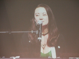 Lisa Furukawa tickling the ivories and singing. I am cheating a little here by photographing the projected image rather than Lisa directly thus the washed out look.