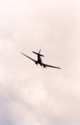 Dakota DC3 in flight, echoing the cover of Mike Oldfield's Five Miles Out album. (23Kb jpeg)