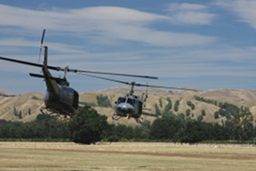 Iroquoi helicopters rotating around each other - effectively dancing up the airfield. (279Kb jpeg)