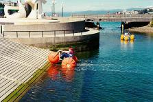 Photograph of me fooling around with a friend in a water trike.